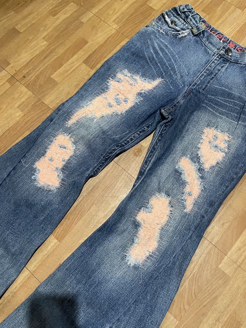 SUPER STAR (Category: Jeans) located in General Santos City (Dadiangas). Submitted by yusofubpon (Listing ID 1460686057, Image 3). Description: WAIST-29to34(stretchable back) LENGTH-42.5 LEGOPENING-11.5 Vintage Flare Jeans Washed blue denim with bold distressed patches, faded detailing, flap back pockets, and a wide bootcut/flare leg..