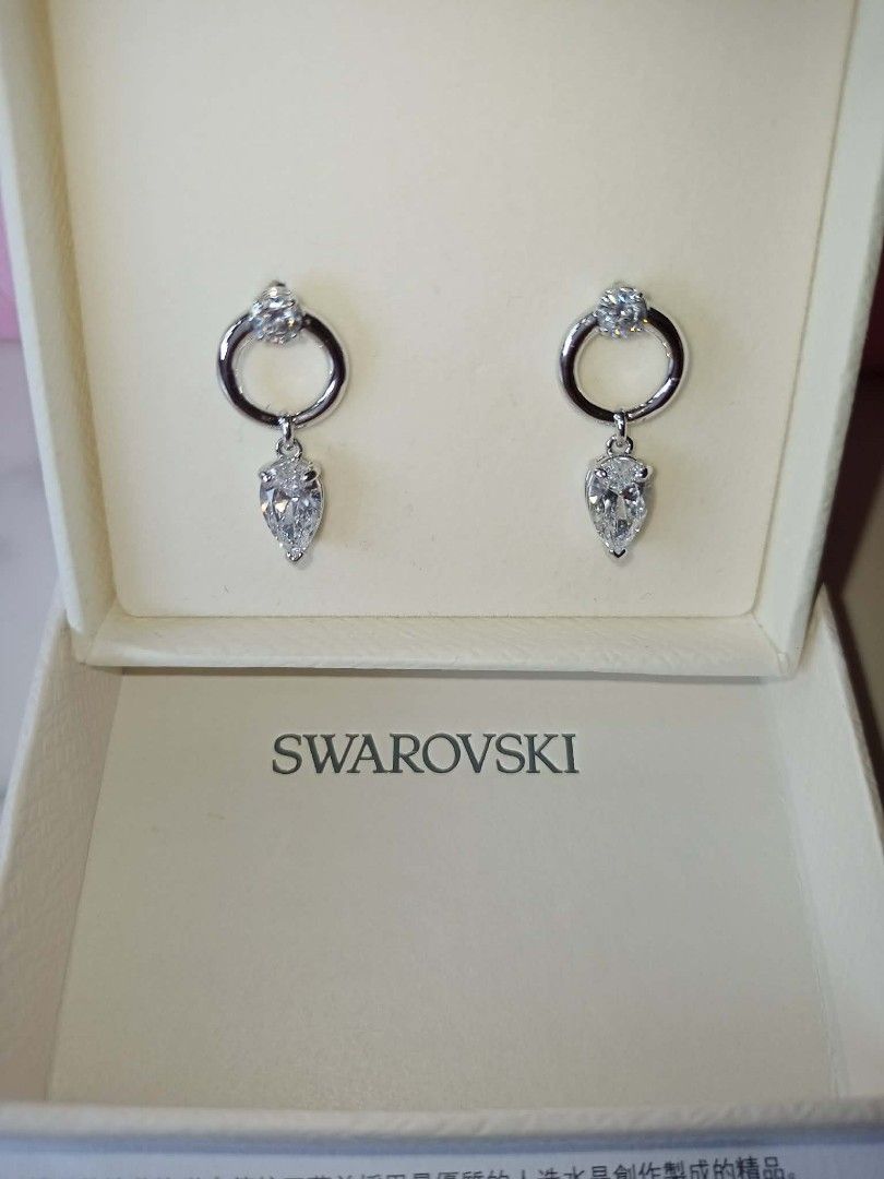 Swarovski Mesmera Earrings (Category: Earrings) located in Mandaluyong City. Submitted by noel_30 (Listing ID 1460589288, Image 2). Description: With Aunthentication card Free cleaning at any swarovski branch just bring the Authentication card Non-Tarnish W/ Box, Pink Paper Bag and Ribbon Article no.: 5723177 Collection: Mesmera Size: 2.2 x 1 cm Material: Rhodium plated, Cubic Zirconia Color: White Weight (individual piece): 1.7 g.