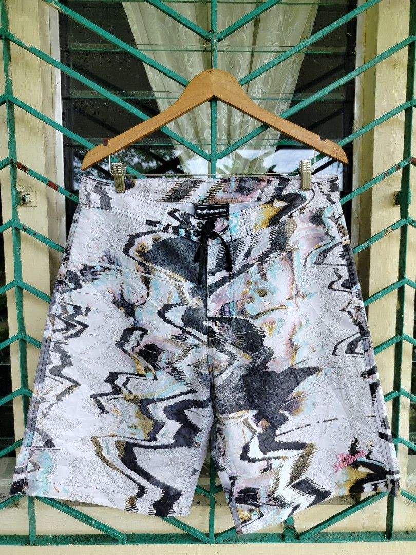 The Hundreds Abstract Print Board Shorts (Category: Shorts) located in Manila. Submitted by geraldquinto_917 (Listing ID 1460591040, Image 1). Description: - Brand: The Hundreds - Style: Abstract print board shorts - Features: Drawstring waist, back pocket - Ideal for: Beach, lounging, casual wear - Design: Unique and eye-catching.