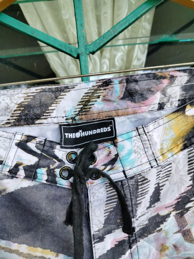 The Hundreds Abstract Print Board Shorts (Category: Shorts) located in Manila. Submitted by geraldquinto_917 (Listing ID 1460591040, Image 2). Description: - Brand: The Hundreds - Style: Abstract print board shorts - Features: Drawstring waist, back pocket - Ideal for: Beach, lounging, casual wear - Design: Unique and eye-catching.