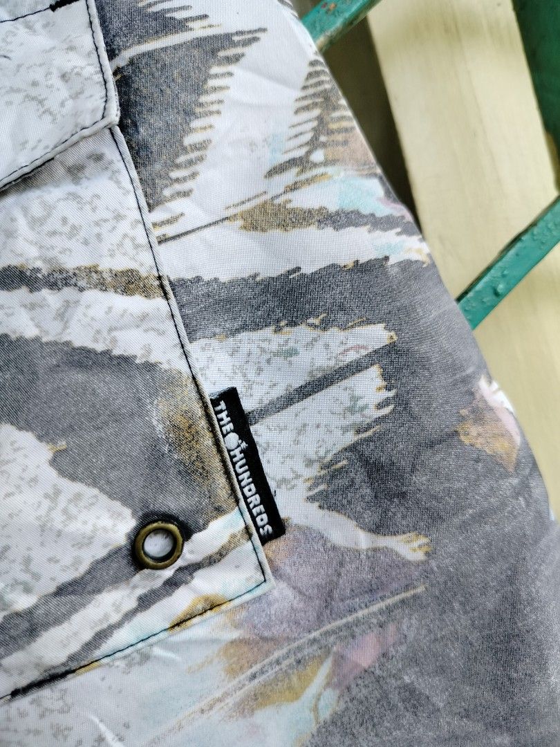 The Hundreds Abstract Print Board Shorts (Category: Shorts) located in Manila. Submitted by geraldquinto_917 (Listing ID 1460591040, Image 3). Description: - Brand: The Hundreds - Style: Abstract print board shorts - Features: Drawstring waist, back pocket - Ideal for: Beach, lounging, casual wear - Design: Unique and eye-catching.