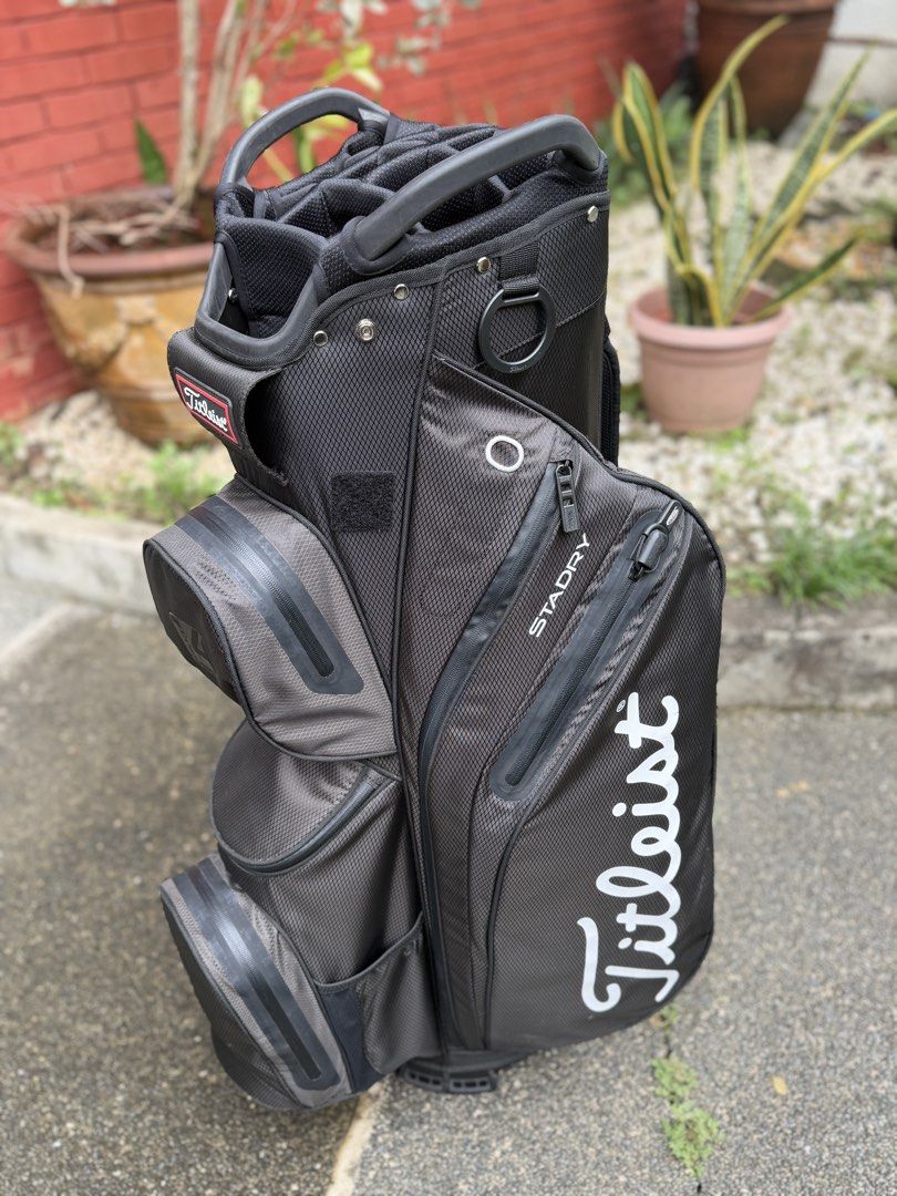 Titleist StaDry Cart 14 Golf bag (Category: Golf) located in Makati City. Submitted by qualityseconds (Listing ID 1460664357, Image 2). Description: - Titleist StaDry golf cart bag - Color: Black with white lettering - Plenty of pockets for all your golf gear - 14 club slot dividers - waterproof.