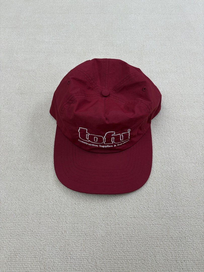 Tofu Construction Supplies & Services Cap Burgundy (Category: Caps & Hats) located in Manila. Submitted by porma.market (Listing ID 1460518936, Image 2). Description: - Burgundy classic baseball cap style - Embroidered 'Tofu Construction Supplies & Services' logo on front - Standard adult size - Minimal signs of wear - Ideal for casual wear or streetwear.