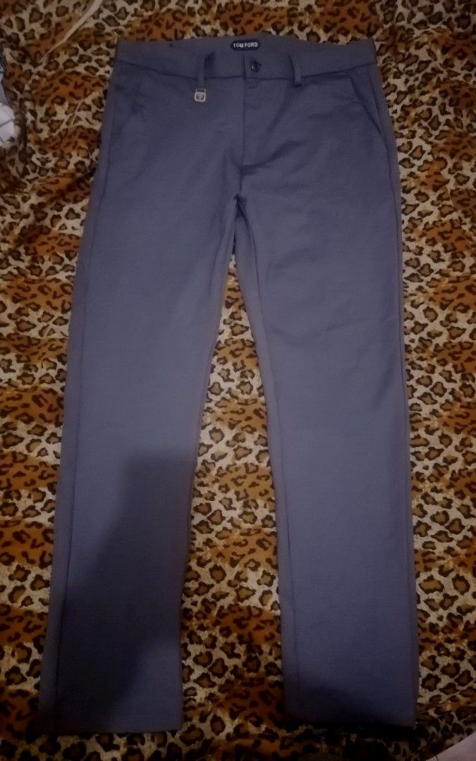 Tom Ford Grey Tailored Trousers Size 34 (Category: Trousers) located in Cebu City. Submitted by roadthrift (Listing ID 1460583530, Image 1). Description: - Brand: Tom Ford - Color: Grey - Size: 34 - Fit: Classic - Style: Smart casual to formal - Closure: Button with zip fly - Pockets: Two side, two back - Material: Comfortable stretch fabric - Care: Machine wash cold inside out.