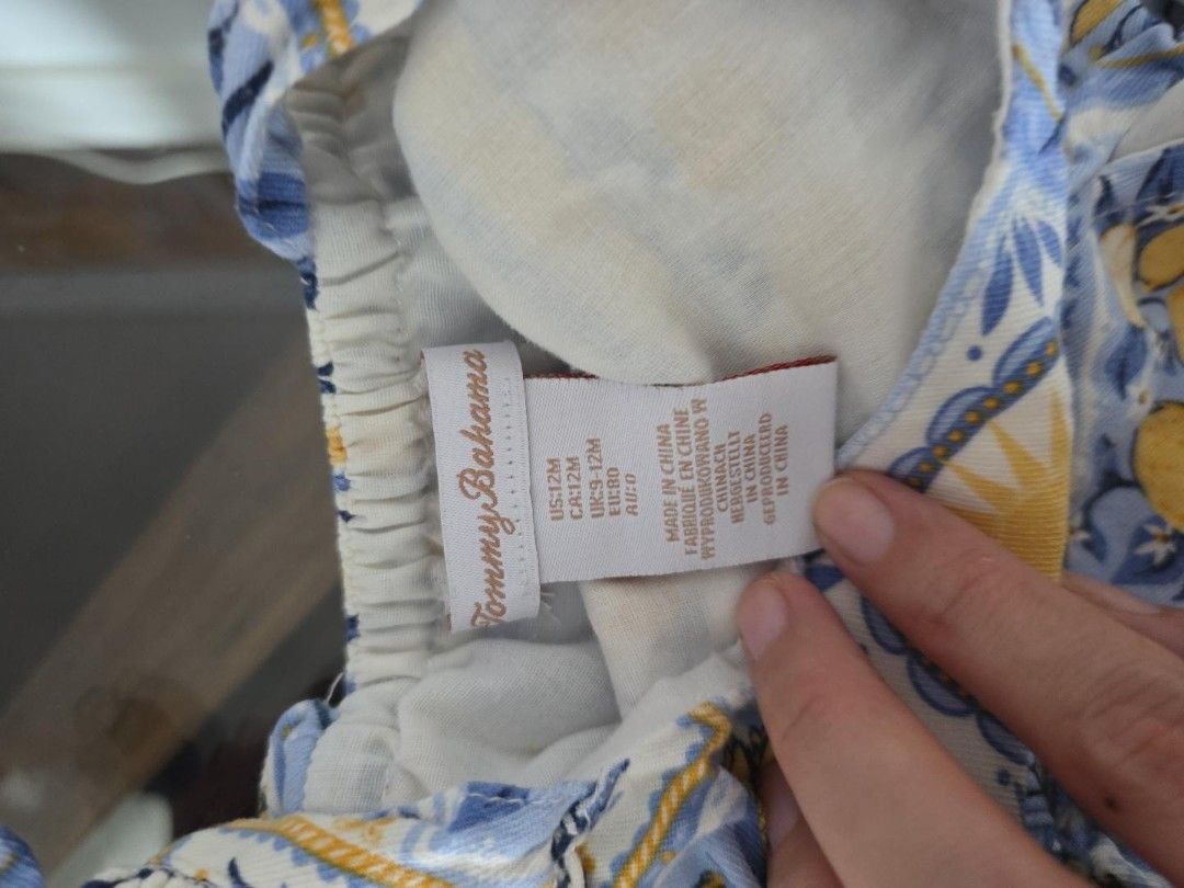 Tommy Bahama Romper 9-12M Lemon Print (Category: Babies & Kids Fashion) located in Makati City. Submitted by kaisabb (Listing ID 1460597559, Image 2). Description: - Brand: Tommy Bahama - Size: 9- 12 months - Design: Fun lemon and blue tile print - Details: Ruffled sleeves and hem with lace trim .