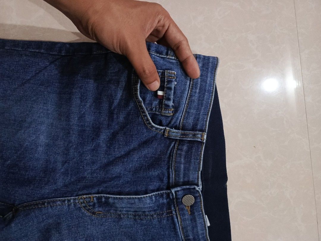 Tommy Hilfiger (Category: Jeans) located in Cabatuan. Submitted by penthegreat (Listing ID 1460507928, Image 2). Description: size 28, hem 8, length 36 10/10 condition, no issue like pinhole No washtag - Brand: Tommy Hilfiger, Thom Browne design sa likod - Style: Blue Flared Jeans - Size: L - Closure: Zipper - Features: Pockets, small embroidered detail on lower leg - Fit: Comfortable, great for casual wear.