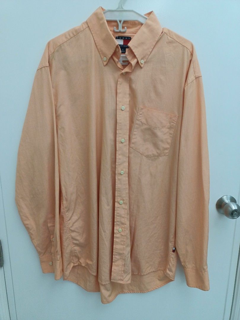 Tommy Hilfiger Long Sleeve Button Down Shirt Size M (Category: Tshirts & Polo Shirts ) located in Pasig City. Submitted by leaves21 (Listing ID 1460667374, Image 1). Description: - Tommy Hilfiger long sleeve shirt - Classic button-down style - Left chest pocket - Made of 100% cotton - Versatile for casual and smart casual outfits - Pre-owned, in good condition.