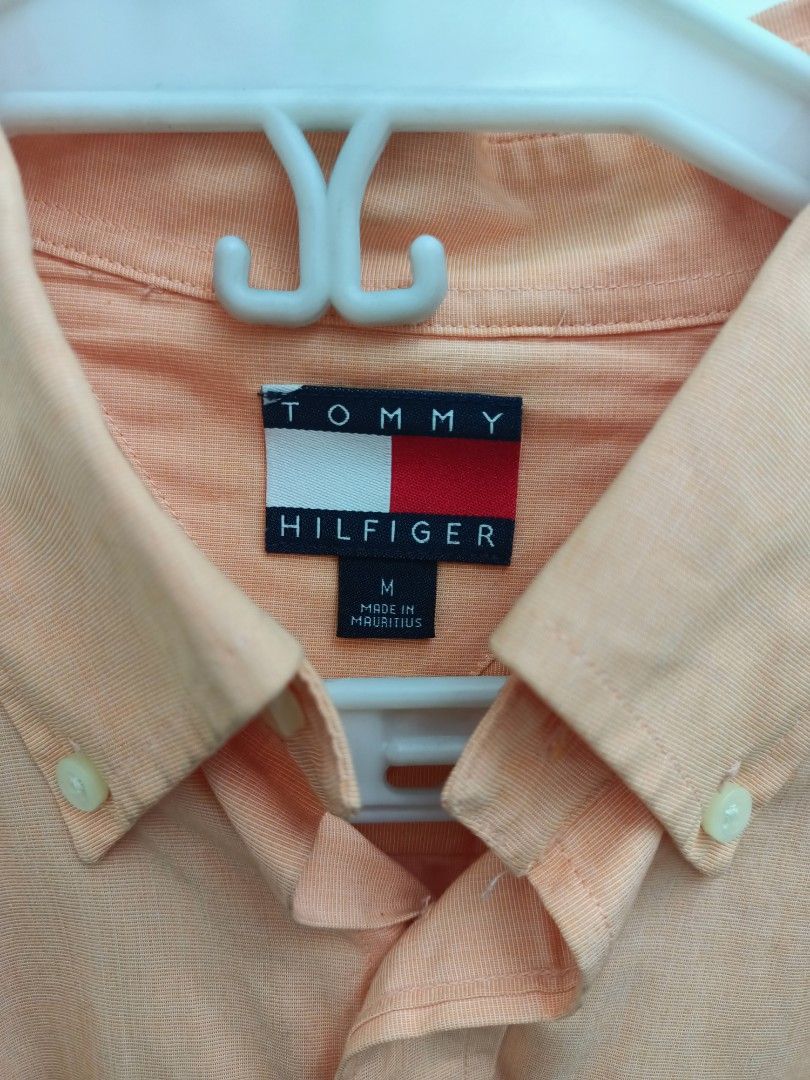 Tommy Hilfiger Long Sleeve Button Down Shirt Size M (Category: Tshirts & Polo Shirts ) located in Pasig City. Submitted by leaves21 (Listing ID 1460667374, Image 2). Description: - Tommy Hilfiger long sleeve shirt - Classic button-down style - Left chest pocket - Made of 100% cotton - Versatile for casual and smart casual outfits - Pre-owned, in good condition.