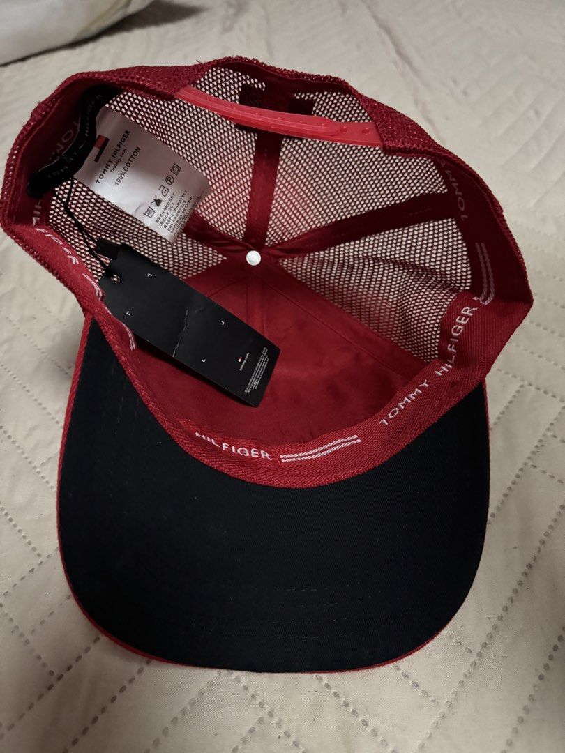 Tommy Hilfiger Red Trucker Cap (Category: Caps & Hats) located in Quezon City. Submitted by kryshnanzyanna (Listing ID 1460602043, Image 3). Description: - Red Tommy Hilfiger trucker cap - Features classic Tommy Hilfiger logo patch - Breathable mesh back for comfort - Brand new with original tags attached - Perfect for casual wear.