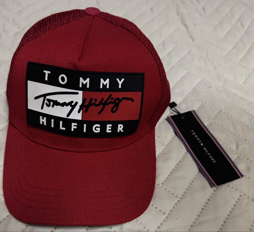 Tommy Hilfiger Red Trucker Cap (Category: Caps & Hats) located in Quezon City. Submitted by kryshnanzyanna (Listing ID 1460602043, Image 1). Description: - Red Tommy Hilfiger trucker cap - Features classic Tommy Hilfiger logo patch - Breathable mesh back for comfort - Brand new with original tags attached - Perfect for casual wear.