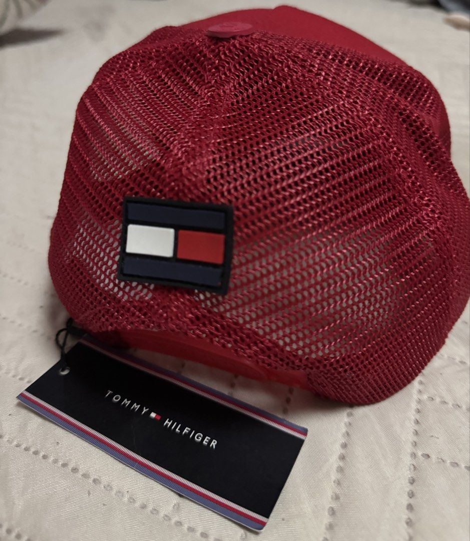 Tommy Hilfiger Red Trucker Cap (Category: Caps & Hats) located in Quezon City. Submitted by kryshnanzyanna (Listing ID 1460602043, Image 2). Description: - Red Tommy Hilfiger trucker cap - Features classic Tommy Hilfiger logo patch - Breathable mesh back for comfort - Brand new with original tags attached - Perfect for casual wear.