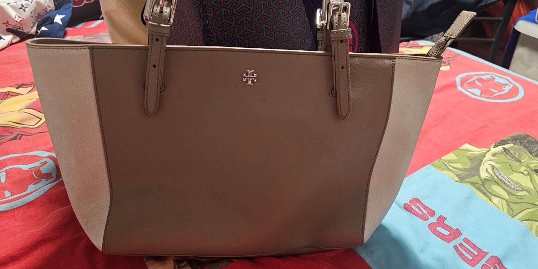 Tory Burch Tote Bag (Category: Tote Bags) located in Manila. Submitted by fanta0923 (Listing ID 1460652659, Image 3). Description: Taupe saffiano leather. Kept in storage .Used once. flawless inside & out. Complete with original dust bag, hang tag & packaging. Perfect gift or treat for yourself!.