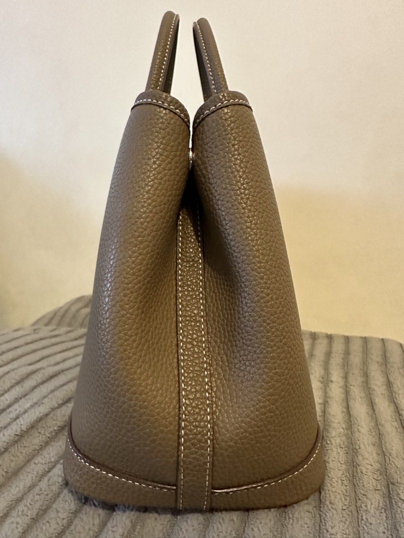 Tote Bag - Pebbled Leather, Taupe (Category: Tote Bags) located in Manila. Submitted by seej0991 (Listing ID 1460593653, Image 3). Description: - Classic tote bag style - Genuine Cowhide Leather - Central snap closure - Interior zippered pocket - Herringbone patterned lining - Ideal everyday bag - Garden Party - Inspired Tote Bag - Price Negotiable - Newly Purchased (2 Week old) - Complete with Dust Bag.