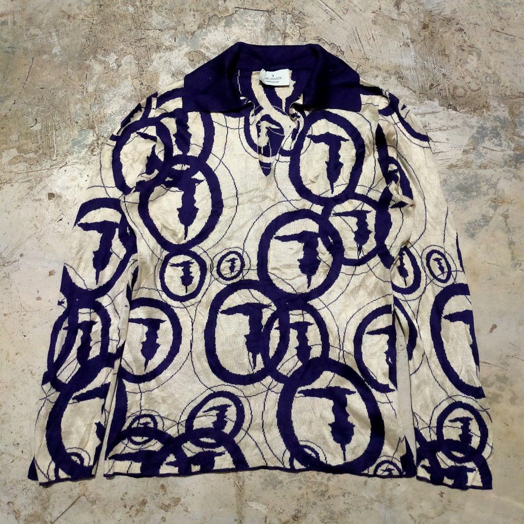 Trussardi Polo Shirt knitted Size M (Category: Luxury Apparel) located in Zamboanga. Submitted by _oliverbmth (Listing ID 1460662615, Image 1). Description: - Brand: Trussardi - Type: Polo Shirt - Color: Cream with Navy Blue Abstract Circle Pattern - Size: Medium (M) - Material: 100% Cotton - Origin: Made in Italy - Care Instructions: Machine washable at 40 degrees Celsius. Do not bleach or iron. - Dimes 17x23.
