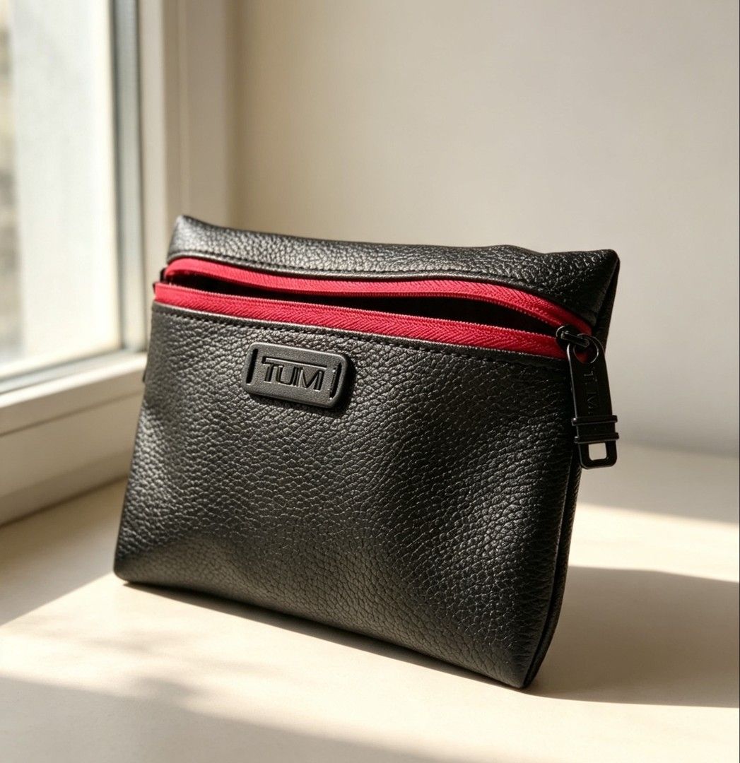 TUMI Travel Mini Bag Pouch (Category: Luxury Bags & Wallets) located in Manila. Submitted by trplxn (Listing ID 1460531388, Image 2). Description: TUMI x El Al premium leather pouch — black with red zipper. Dual zip, travel/cosmetic organizer. Like new condition! Limited edition, high quality. Perfect for daily use or travel. Message for more product details!.