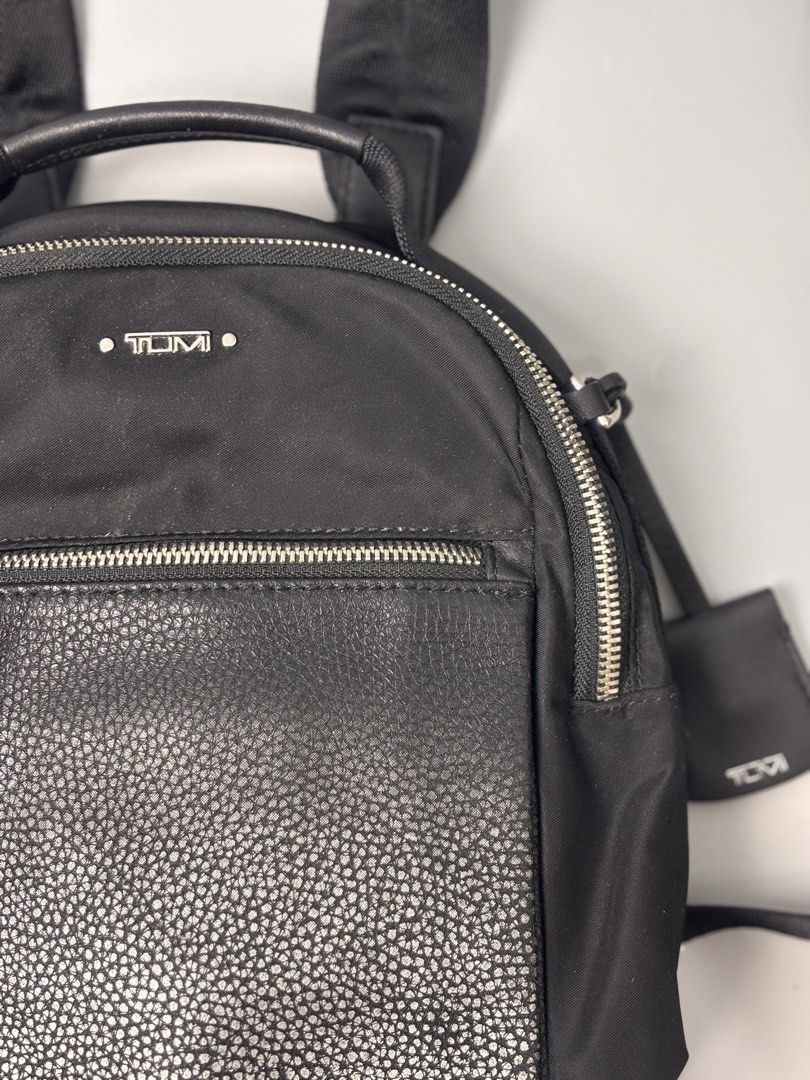 TUMI Voyageur Witney Backpack (Category: Backpacks) located in Quezon City. Submitted by willsmile (Listing ID 1460628410, Image 2). Description: TUMI Voyageur Witney Backpack, featuring a sleek black nylon body paired with a textured metallic front pocket Free shipping within Metro Manila Additional shipping charges for provincial deliveries Please read the description before buying MOP: gcash, bank transfer (bpi) Courier: J&T, lalamove Please v
