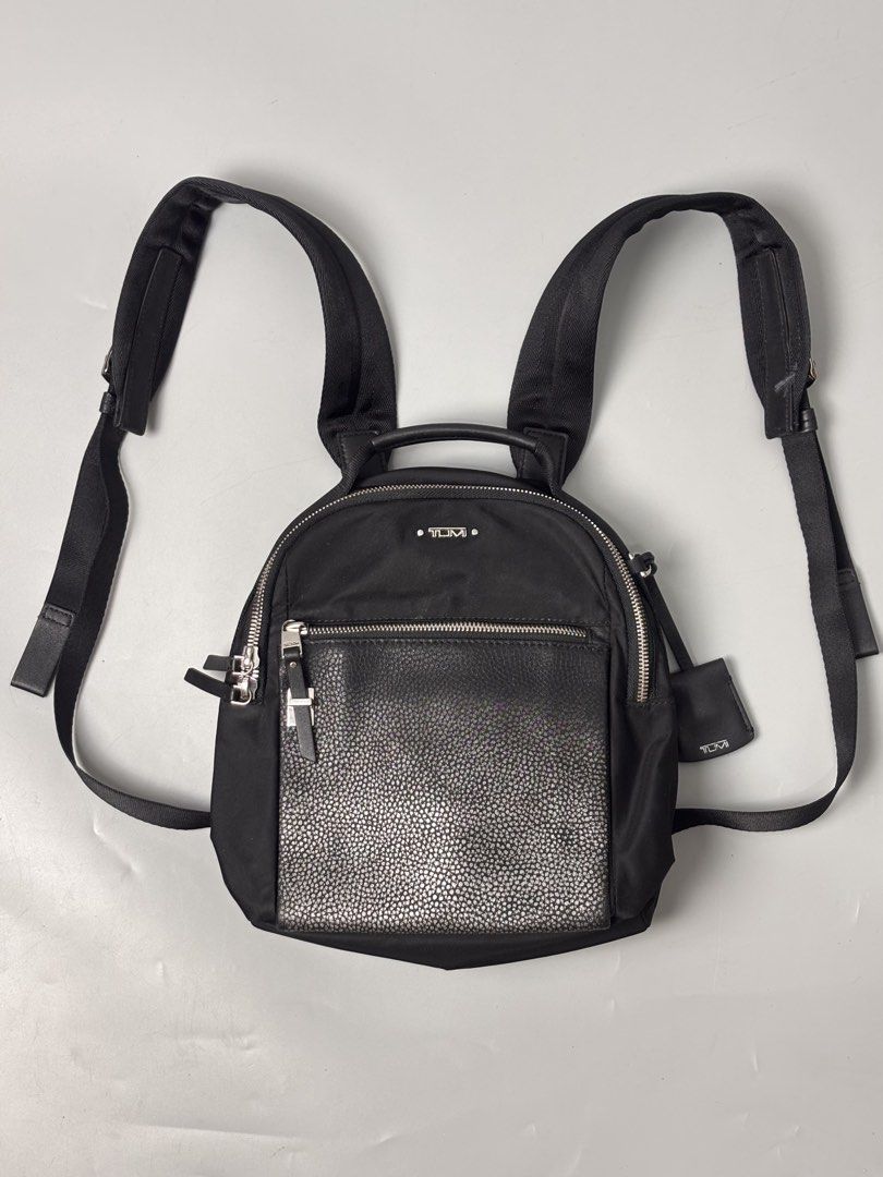 TUMI Voyageur Witney Backpack (Category: Backpacks) located in Quezon City. Submitted by willsmile (Listing ID 1460628410, Image 1). Description: TUMI Voyageur Witney Backpack, featuring a sleek black nylon body paired with a textured metallic front pocket Free shipping within Metro Manila Additional shipping charges for provincial deliveries Please read the description before buying MOP: gcash, bank transfer (bpi) Courier: J&T, lalamove Please v