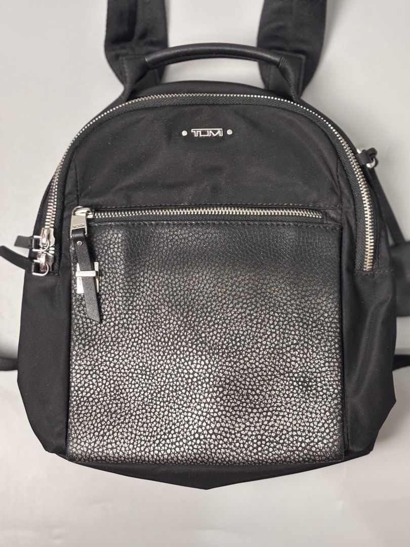 TUMI Voyageur Witney Backpack (Category: Backpacks) located in Quezon City. Submitted by willsmile (Listing ID 1460628410, Image 3). Description: TUMI Voyageur Witney Backpack, featuring a sleek black nylon body paired with a textured metallic front pocket Free shipping within Metro Manila Additional shipping charges for provincial deliveries Please read the description before buying MOP: gcash, bank transfer (bpi) Courier: J&T, lalamove Please v