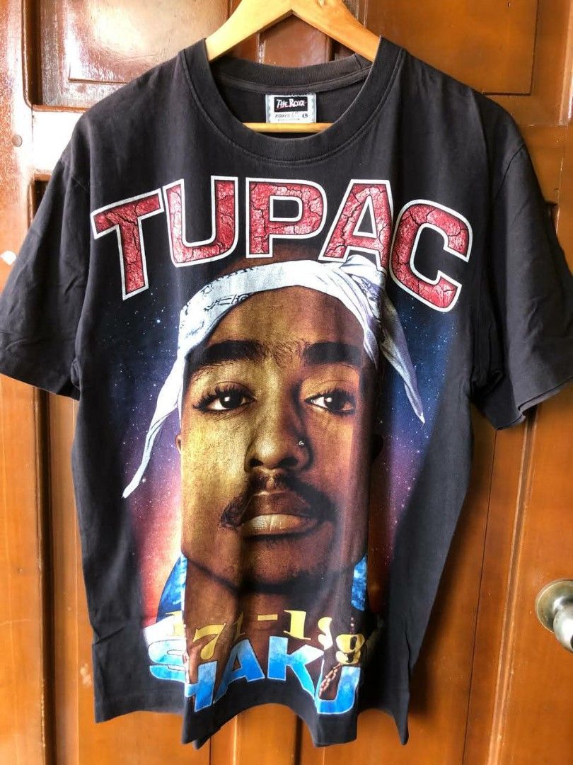 Tupac Shakur Rap tee (Category: Formal Shirts) located in Santiago. Submitted by johnmichael1213 (Listing ID 1460568237, Image 1). Description: Size: L-XL 22-23width 28-29 length Good condition Issue:crack prints/ multiple pinholes.