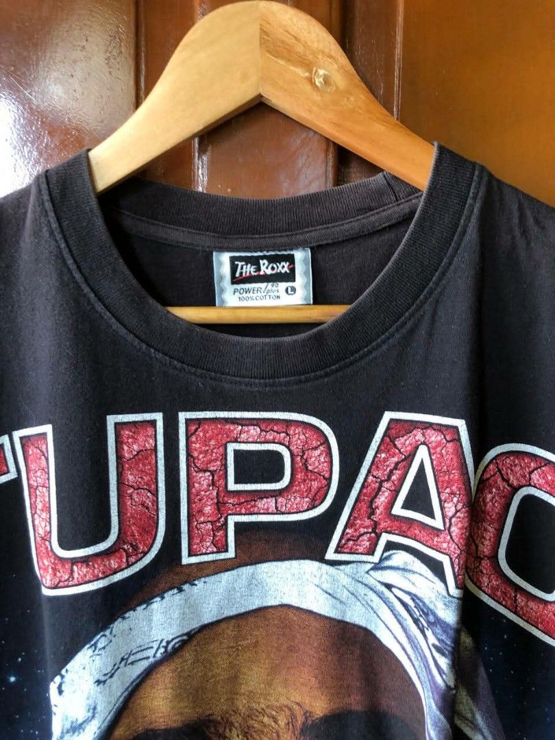 Tupac Shakur Rap tee (Category: Formal Shirts) located in Santiago. Submitted by johnmichael1213 (Listing ID 1460568237, Image 3). Description: Size: L-XL 22-23width 28-29 length Good condition Issue:crack prints/ multiple pinholes.