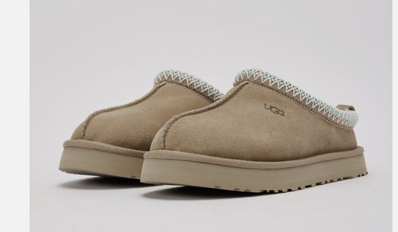 UGG "W Tasmen Beige" suede slippers (Category: Slippers and slides) located in Baguio. Submitted by workwear2600 (Listing ID 1460643641, Image 2). Description: - UGG Tasman Slippers - Color: Chestnut - Material: Suede upper with cozy shearling lining - Design: Classic UGG logo and braided trim detail - Style: Easy slip-on - 2500 sb .