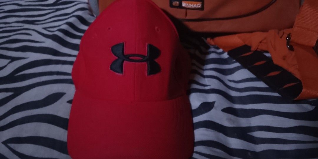 Under Armour UA Classic Fit Cap Red (Category: Caps & Hats) located in Bulacan. Submitted by changchang31 (Listing ID 1460708986, Image 1). Description: - Under Armour Classic Fit Cap - Color: Red - Versatile: Perfect for sports or casual outings - Features an adjustable strap for a comfortable, customized fit - Feel free to ask any questions!.