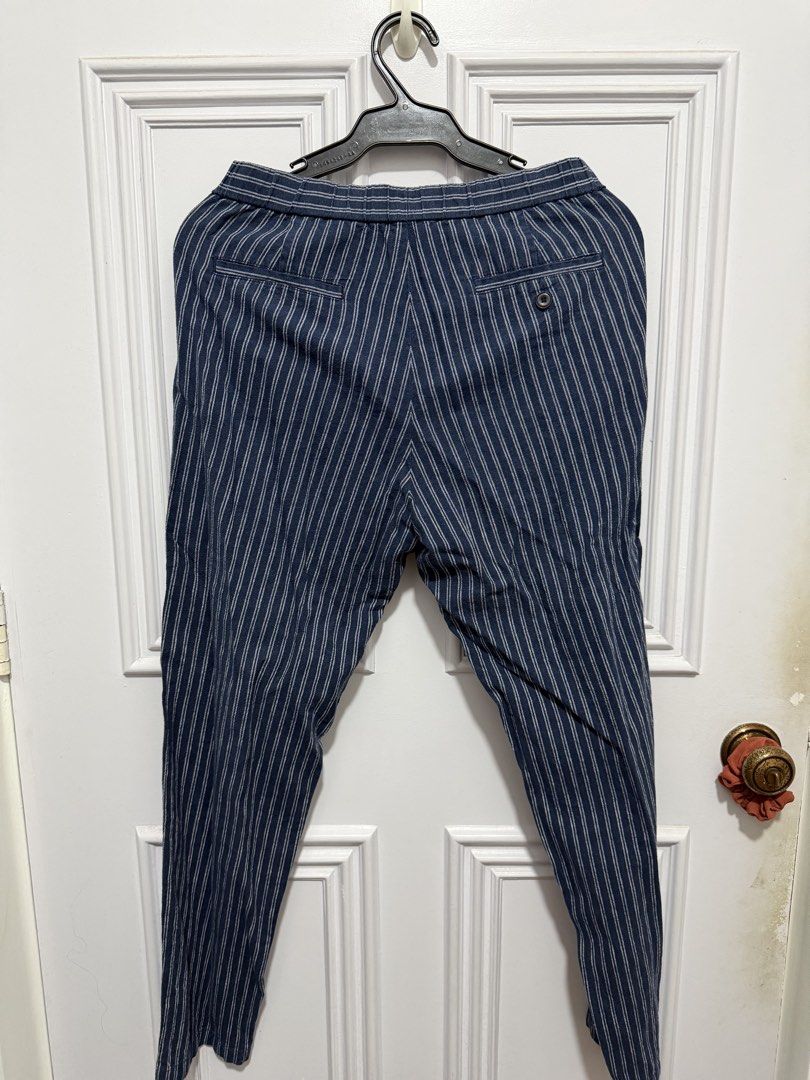 Uniqlo Striped Trousers (Category: Other Bottoms) located in Quezon City. Submitted by ayybee_closet (Listing ID 1460673992, Image 2). Description: - Trousers with button and tie straps to tighten waist area - Straight cut - Linen fabric.