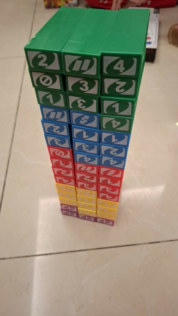 UNO Stacko Game - Fun Stacking and Pulling Blocks (Category: Board Games & Puzzles) located in Caloocan City. Submitted by epicmoon-9beaf2 (Listing ID 1460612733, Image 3). Description: - UNO Stacko: The exciting stacking game based on UNO! - How to Play: Pull blocks and stack them on top, making the tower taller and more challenging. - Perfect for Family Game Nights: Guaranteed fun for everyone. - What's Included: 45 colorful blocks and the game