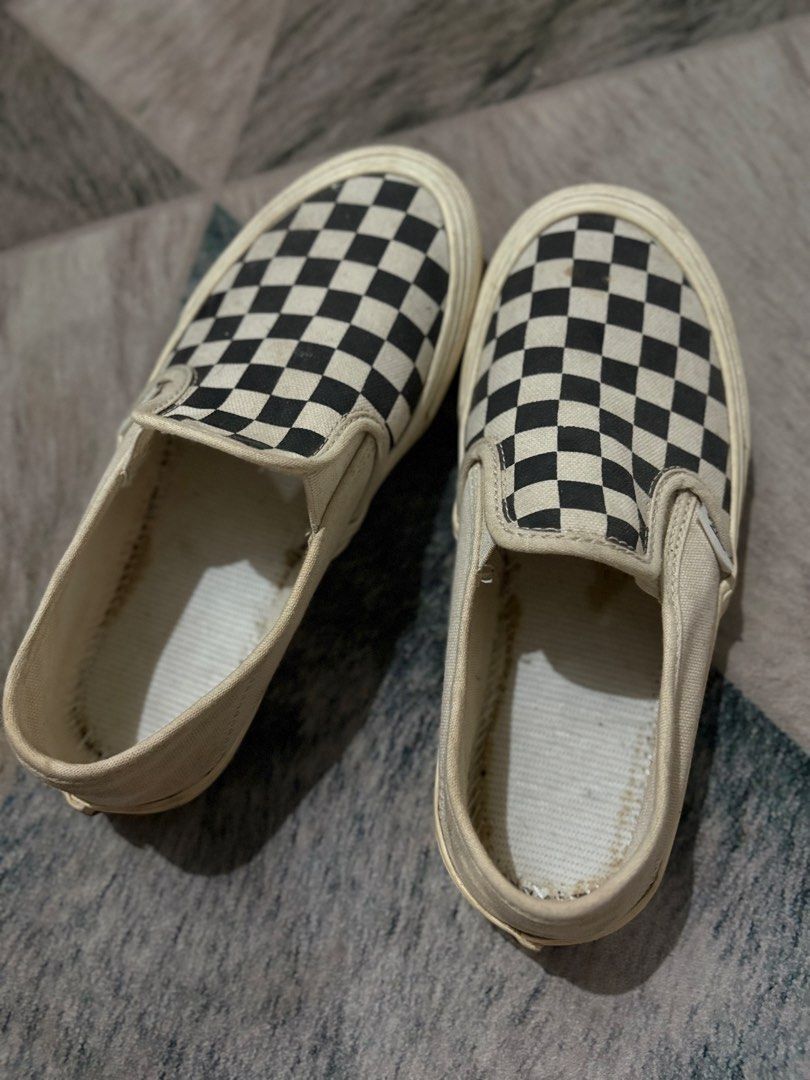 Vans Checkerboard Slip-On Shoes (Category: Sneakers) located in Baler. Submitted by yansboutique2023 (Listing ID 1460710998, Image 1). Description: - Classic Vans checkerboard slip-on shoes - Beige/off-white color - Made of durable canvas material - Shows some signs of wear on insoles and edges - Plenty of life remaining for continued use - Ideal for everyday casual wear.