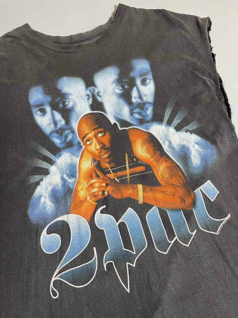 Vintage 2pac Rap tee tour champ tag (Category: Tshirts & Polo Shirts ) located in Lucena. Submitted by sth.archvl (Listing ID 1460577387, Image 3). Description: Beaters condition Good fade Issue multiple pinholes and cut sleeves Size XL Measurements Armpit to armpit: 23.5 Length: 30 .