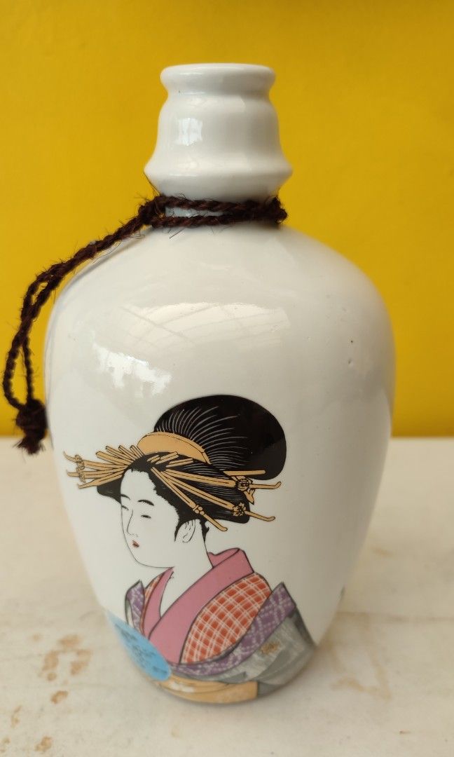 Vintage Ceramic Sake Bottle (Category: Vases & Decorative Bowls) located in Mandaluyong City. Submitted by lalahhome (Listing ID 1460556550, Image 1). Description: Japanese Ceramic Sake Bottle Vintage With beautiful print of Geisha No markings 8.5" height.