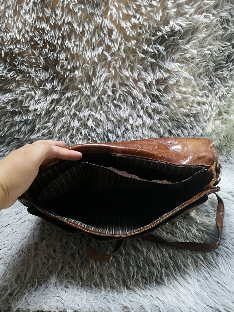 Vintage Embossed Pattern Messenger Bag (Category: Sling Bags) located in Santa Cruz. Submitted by jmy_surplus.2 (Listing ID 1460587291, Image 3). Description: Size ; L - 10 W - 14 Color ; Brown Type ; Messenger Bag Brand ; No brand Material ; Leather Style ; Brown leather Central Push Lock Closure messenger bag LR 167 JMY 1 Batch #219.