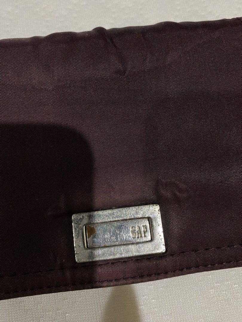 vintage GAP plum wallet (coach, gap, gucci, guess, wallet, leather, canvas, silver hardware) (Category: Wallets & Card holders) located in Marikina City. Submitted by tomie_kawakami (Listing ID 1460635002, Image 2). Description: - flaws are clearly seen in the photos 💗 - small tarnish on logo - authentic - signs of use due to aging - slight discoloration - the fabric swelled - 7/10 condition 💗 - reasonable for its price - no rubs or damage on i