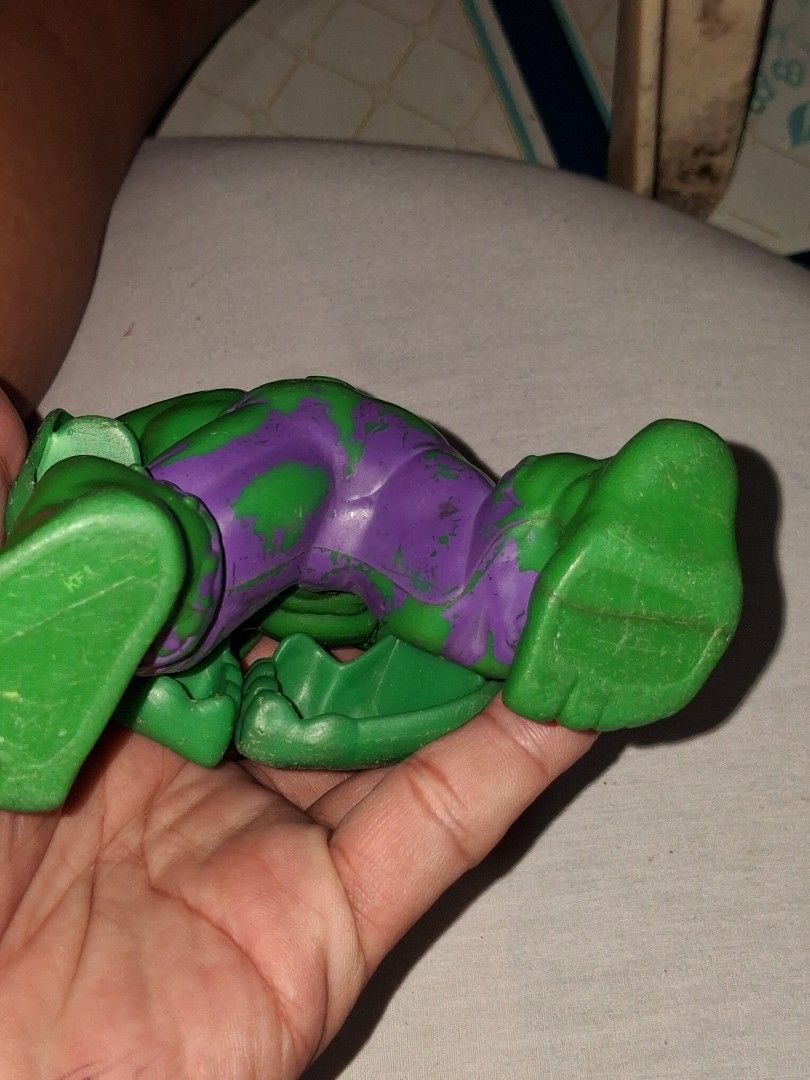 Vintage Hulk Action Figure Toy (Category: Action & Battle Toys) located in Manila. Submitted by marcas022798212 (Listing ID 1460628495, Image 2). Description: - Vintage Hulk action figure - Classic green and purple colors - Shows some paint wear on purple parts (consistent with age) - Features articulated joints - Perfect for collectors and fans - Ideal for display.