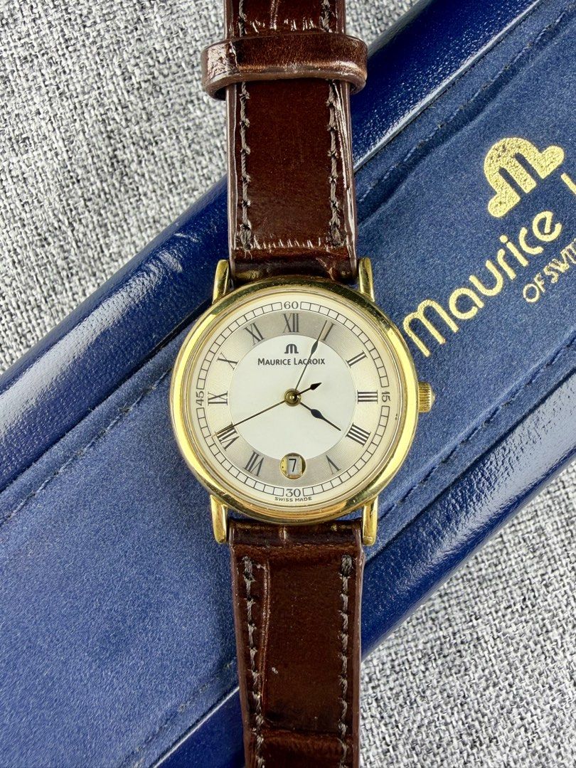 Vintage Maurice Lacroix Arios (Category: Women's Watches) located in Bacoor. Submitted by offtheclock (Listing ID 1460681583, Image 2). Description: Vintage Maurice Lacroix Arios Condition: Pre-owned Reference No. AR1013-YP011-110-1 Movement: Swiss Quartz (ML800) Material: Stainless Steel Yellow Gold-Plated Case Diameter: 28mm (Sapphire Crystal) Dial: Classic Lacquered White / Silver Inclusion: Brandnew Aftermarket Brown Leather Strap Inclusion: 