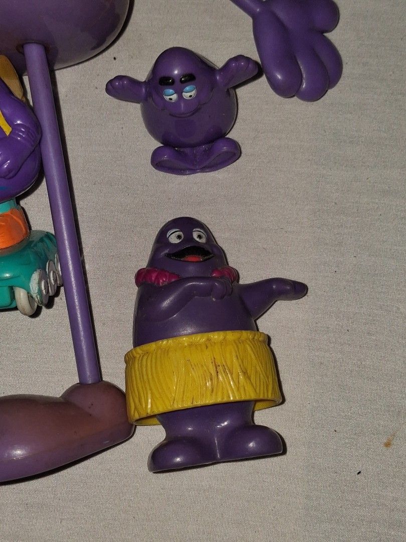 Vintage McDonald's Grimace Shake Toy Set (Category: Vintage Collectibles) located in Manila. Submitted by marcas022798212 (Listing ID 1460620255, Image 2). Description: - Set of vintage McDonald's Grimace toys - Includes Grimace figures and accessories - Some pieces are detachable - Ideal for collectors and fans of classic McDonald's memorabilia - Fun, nostalgic items from the past.