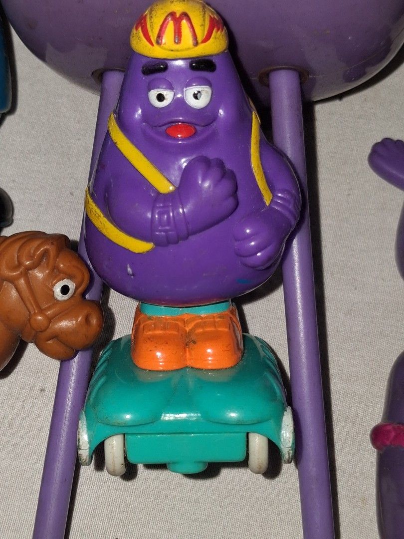 Vintage McDonald's Grimace Shake Toy Set (Category: Vintage Collectibles) located in Manila. Submitted by marcas022798212 (Listing ID 1460620255, Image 3). Description: - Set of vintage McDonald's Grimace toys - Includes Grimace figures and accessories - Some pieces are detachable - Ideal for collectors and fans of classic McDonald's memorabilia - Fun, nostalgic items from the past.