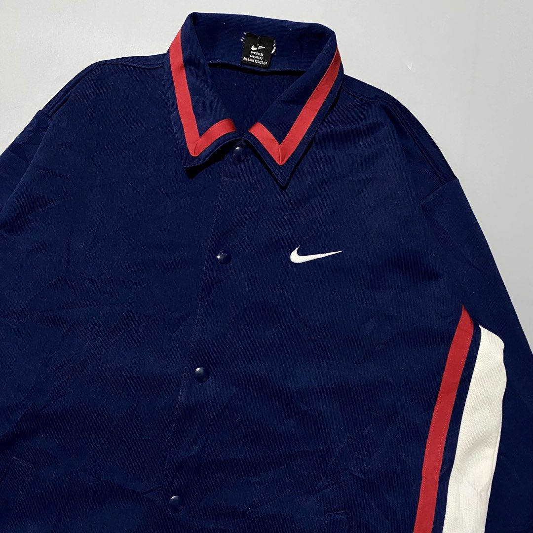 Vintage Nike Jacket Navy Blue Red White (Category: Coats, Jackets and Outerwear) located in Imus. Submitted by fndsvntg_307 (Listing ID 1460677820, Image 3). Description: - Classic Nike jacket - Navy blue with red and white stripe details - Button-up front - Team Nike tag - Made in Japan - Ideal for casual wear or sports.