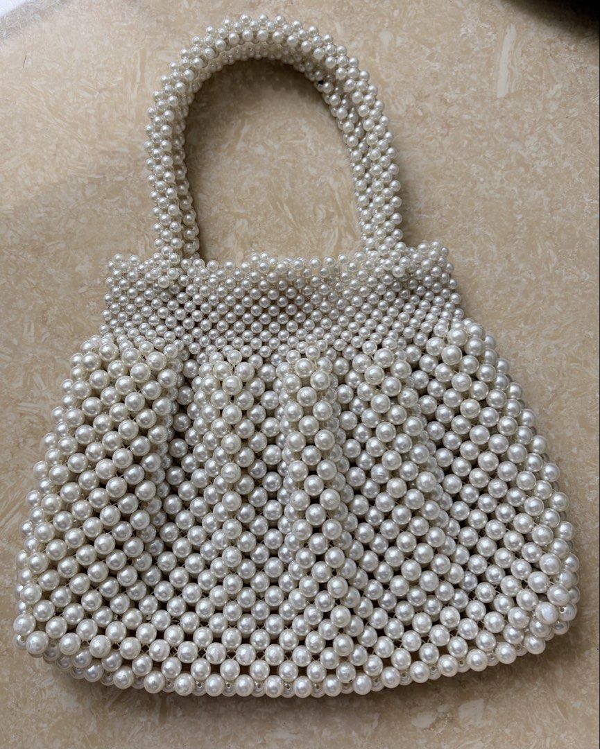 Vintage Pearl Beaded Handbag with Handle (Category: Purses & Pouches) located in Pasig City. Submitted by flotemp81845107 (Listing ID 1460598925, Image 2). Description: - Adorable white beaded handbag - Fully covered in lustrous pearls - Features a sturdy, comfortable handle - Ideal for parties, events, or a night out - Compact and easy to carry - Unique and eye-catching design Shipping care of buyer. Location: Kapitolyo, Pasig.
