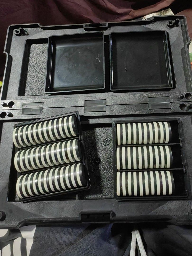vintage portable Magnet Othello board game (Category: Board Games & Puzzles) located in Calamba. Submitted by princesspauliney. (Listing ID 1460657076, Image 3). Description: vintage portable Magnet Othello board game Type: Folding magnetic strategy board game (also known as Reversi). Design Features: The black plastic backing functions as a dual storage compartment for the reversible playing pieces when closed, and flips open to reveal the grid-