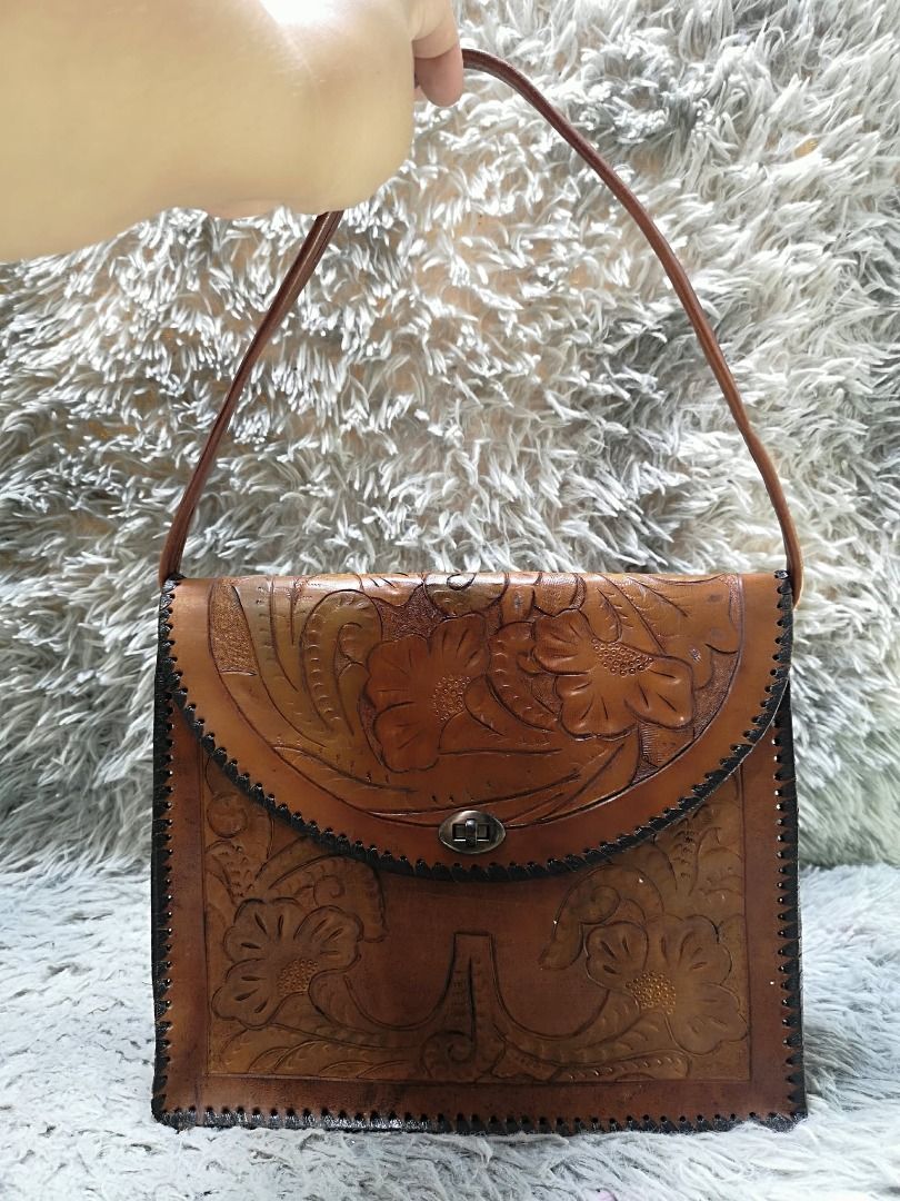 Vintage Style Hand Tooled Brown leather Shoulder Bag (Category: Shoulder Bags) located in Santa Cruz. Submitted by jmy_surplus.2 (Listing ID 1460596721, Image 3). Description: Size ; L - 9 W - 10.5 Color ; Brown Type ; Shoulder Bag Brand ; No brand Material ; leather Style ; Brown Floral Embossed Pattern Shoulder bag LR 165 JMY 1 Batch #219.