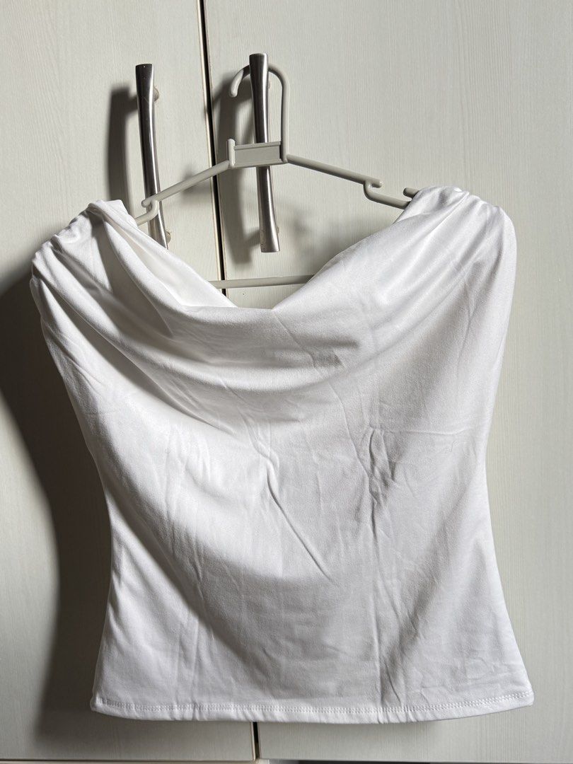 VXN — Celina White Off Shoulder Top (Category: Sleeveless) located in Agoo. Submitted by ashestacio (Listing ID 1460592205, Image 1). Description: - Chic white tube top - Elegant cowl neckline - Stretchy fabric for comfort - Best fits size S or M - Perfect for dressing up or down - Easily pairs with skirts and pants.