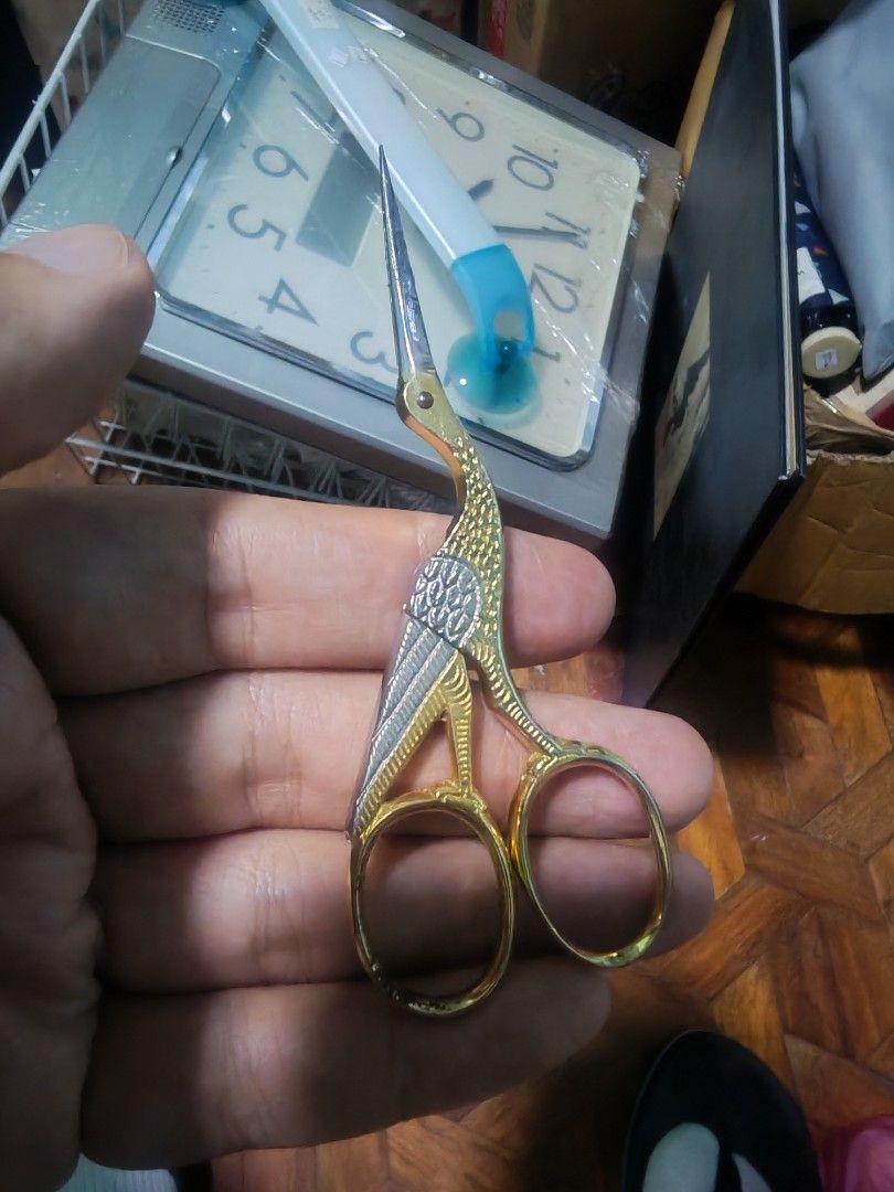 Wasa Solingen Crane Embroidery Scissors Gold Silver (Category: Craft Supplies & Tools) located in Manila. Submitted by GentleGiant (Listing ID 1460608023, Image 1). Description: - Vintage embroidery scissors - Made in Solingen, Germany - Unique crane embroidery design - Gold and silver finish - Blades show minor signs of age and use, still sharp and functional - Handle has some discoloration - Ideal for crafting or as a decorative accent.