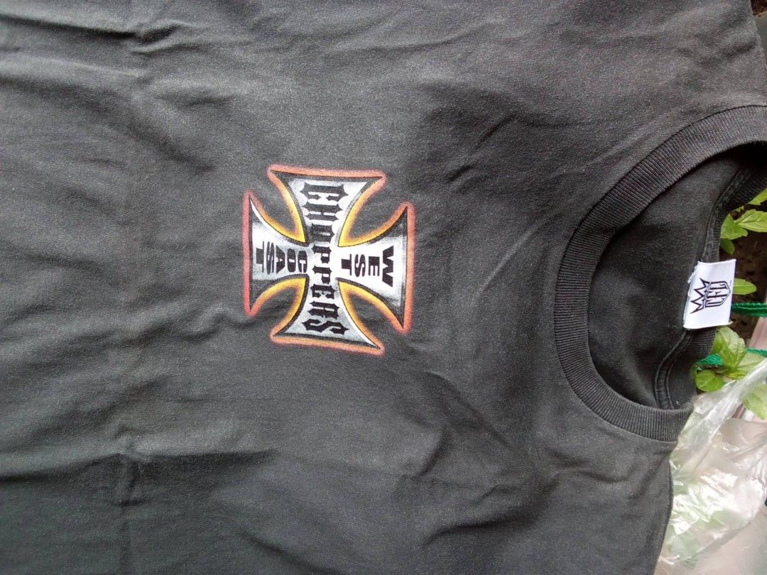 West Coast Choppers T-Shirt (Category: Tshirts & Polo Shirts ) located in Manila. Submitted by romeoamoro00044 (Listing ID 1460529683, Image 1). Description: - Black t-shirt - West Coast Choppers graphic print (front and back) - Features large cross logo with motorcycle - Tag visible inside collar - Ideal for chopper and motorcycle enthusiasts.