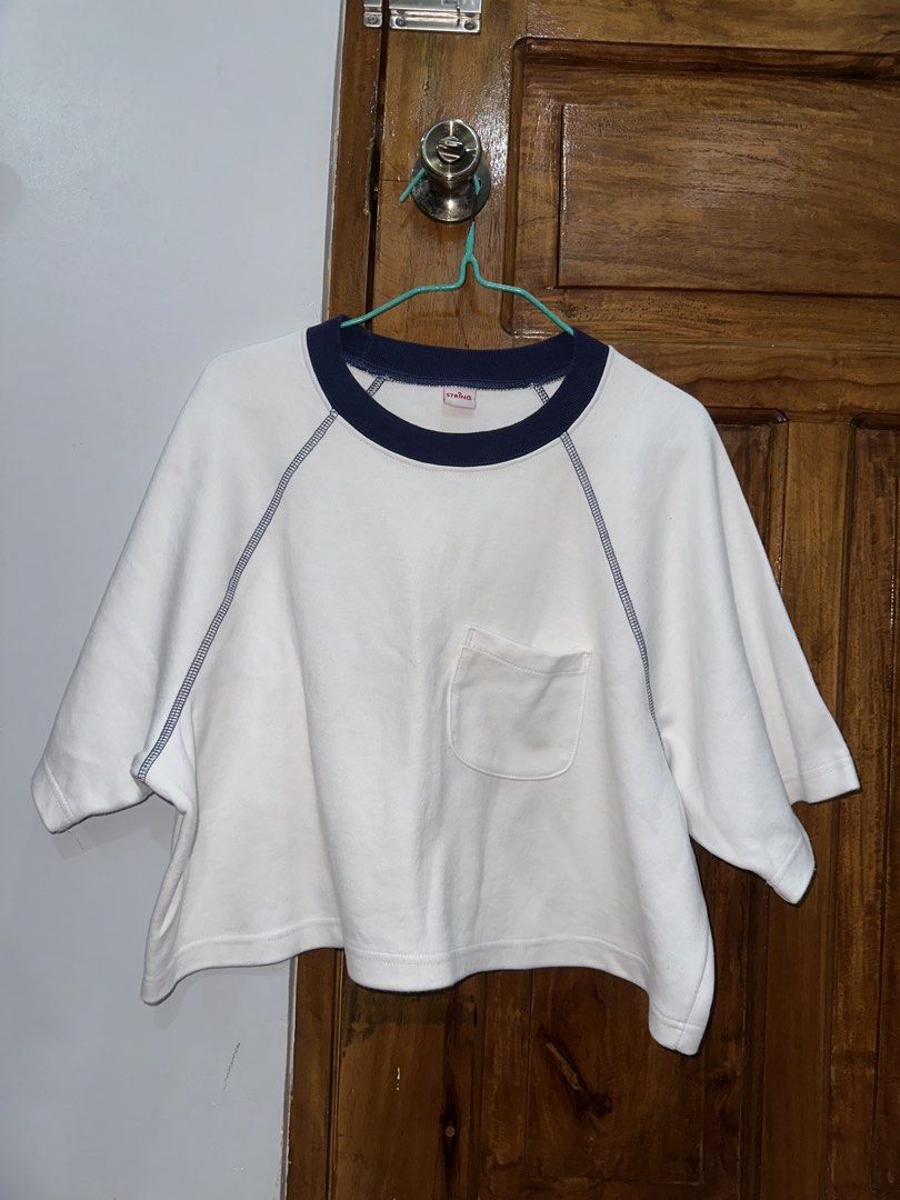 White Cropped Sweatshirt with Navy Collar and Pocket (Category: Longsleeves) located in Cauayan City . Submitted by sherinejoy_ (Listing ID 1460673669, Image 1). Description: - White cropped sweatshirt - Navy blue collar - Raglan sleeves with contrast stitching - Small chest pocket - Relaxed fit, super comfy - Ideal for casual wear with jeans or shorts.