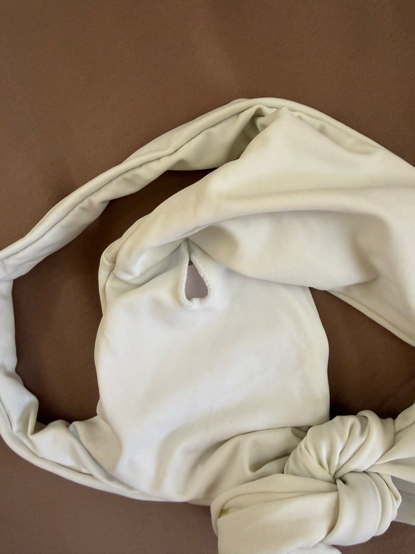 White Knotted Bikini Top - Size M (Category: Bikinis & Swimsuits) located in Bulacan. Submitted by preloved_bygrace (Listing ID 1460676025, Image 2). Description: - White bikini top - Cute knot detail at the front - Material: 80% Nylon, 20% Spandex - Size: M Note: Color may vary due to lighting. RFS: decluttering, need funds *Buyer shoulders the SF (J&T or Lalamove) **Can offer discounts if you get 2 or more items from my listings.