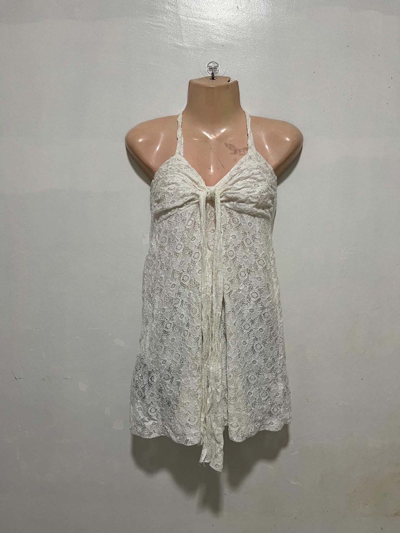 White Lace Halter Neck Mini Dress (Category: Dresses) located in Oroquieta. Submitted by zjstg (Listing ID 1460645078, Image 1). Description: - Cute white lace mini dress - Halter neck with tie front - Perfect for beach days or layering - Intricate and pretty lace pattern - Looks great on its own or over swimwear - Lightweight and flowy material Dimensions Ptp: 13” Length: 22” Excellent/No issue 250+sf.