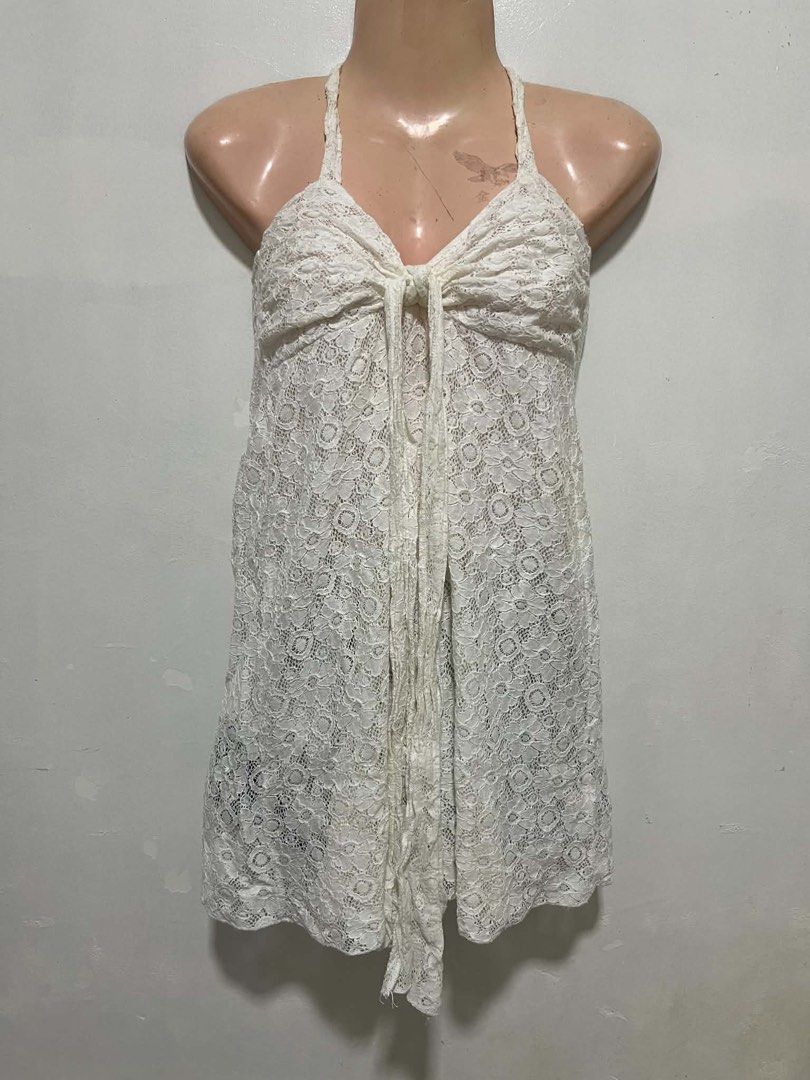 White Lace Halter Neck Mini Dress (Category: Dresses) located in Oroquieta. Submitted by zjstg (Listing ID 1460645078, Image 2). Description: - Cute white lace mini dress - Halter neck with tie front - Perfect for beach days or layering - Intricate and pretty lace pattern - Looks great on its own or over swimwear - Lightweight and flowy material Dimensions Ptp: 13” Length: 22” Excellent/No issue 250+sf.