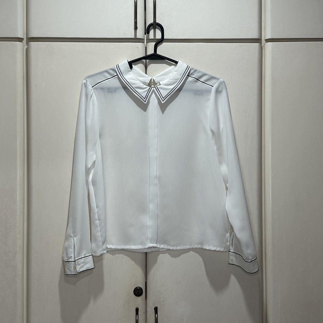 White Long Sleeve Contrast Trim Blouse (Category: Longsleeves) located in Muntinlupa City. Submitted by pickjes (Listing ID 1460700135, Image 1). Description: Brand: Cooperative Size: Medium Color: White Measurements: • Shoulder - 15” • Chest - 19.5” • Length - 20.5” • Sleeve - 21” Material: 100% polyester Condition: Lightly used. No flaws. RFS: Decluttering Classy design, presko, classic versatile top - from casual, travel, smart to business cas