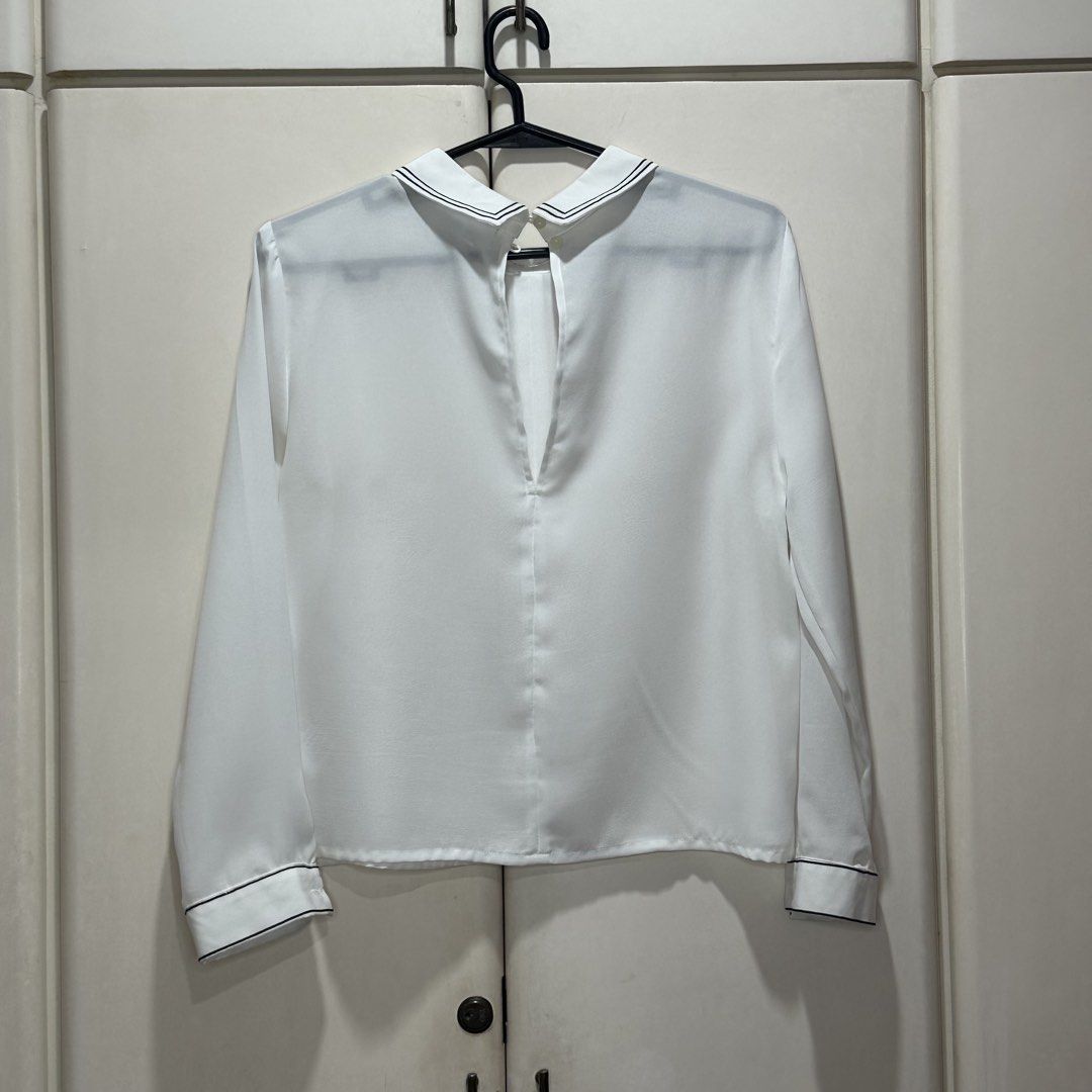 White Long Sleeve Contrast Trim Blouse (Category: Longsleeves) located in Muntinlupa City. Submitted by pickjes (Listing ID 1460700135, Image 2). Description: Brand: Cooperative Size: Medium Color: White Measurements: • Shoulder - 15” • Chest - 19.5” • Length - 20.5” • Sleeve - 21” Material: 100% polyester Condition: Lightly used. No flaws. RFS: Decluttering Classy design, presko, classic versatile top - from casual, travel, smart to business cas